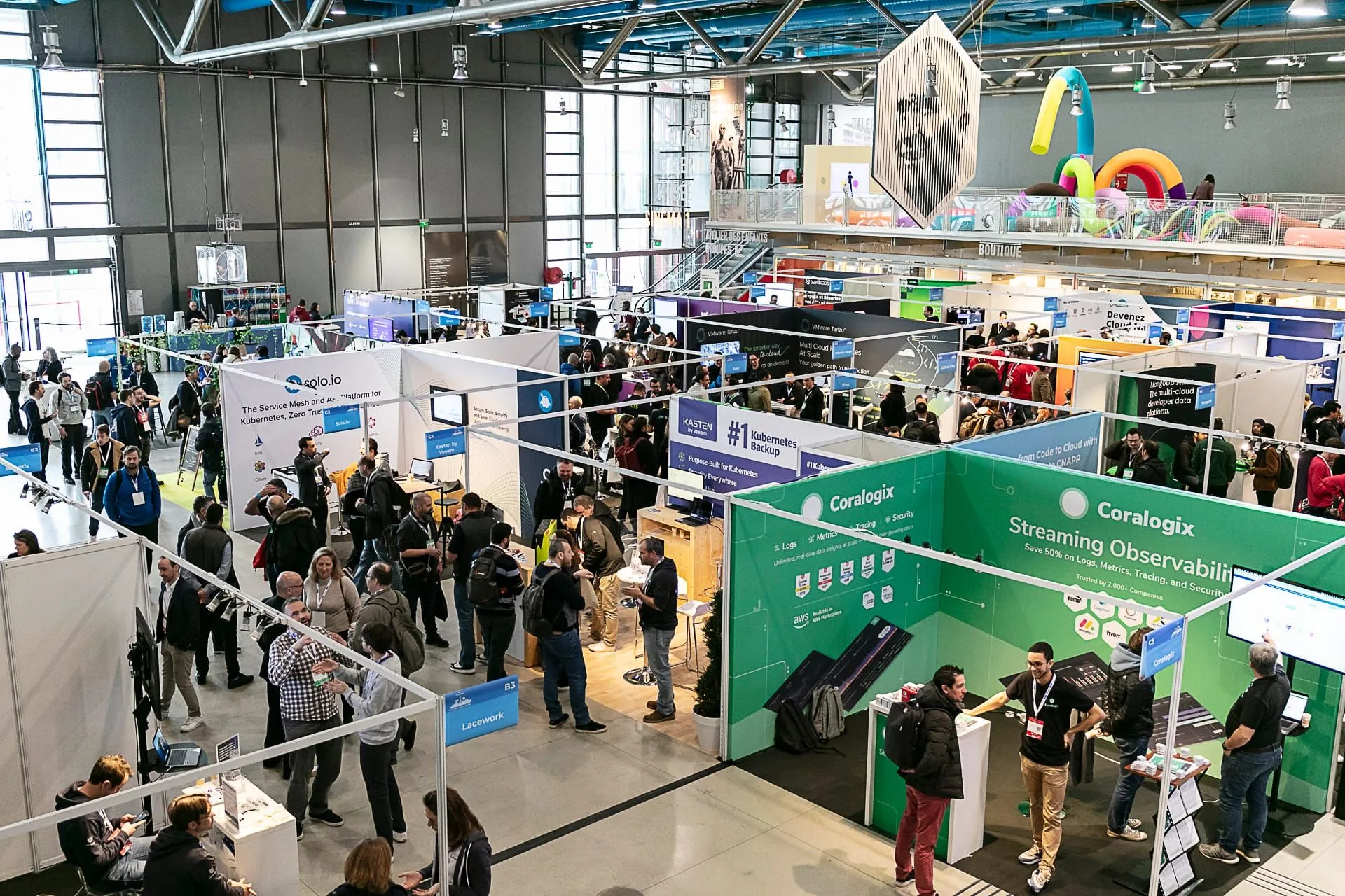 Partner sponsor booth staffed by two hosts, KCD signage visible